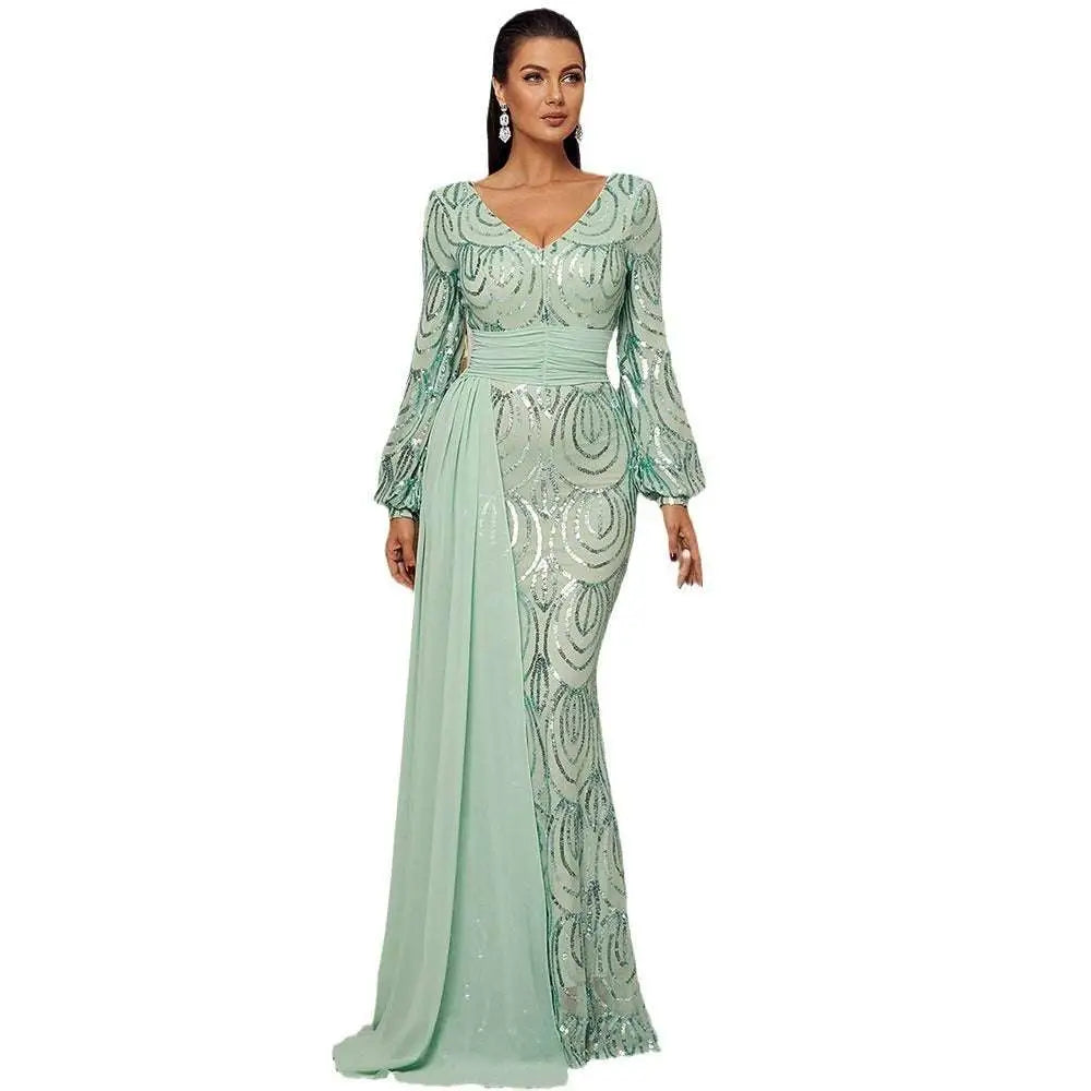 A shimmering mint green long sleeve sexy sequined evening dress with fitted silhouette and intricate swirl patterns