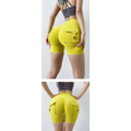 Bright yellow high-waisted athletic shorts with cargo pockets and button closures in celebrity nude feel style