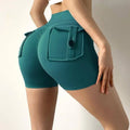 Mint green nude feel pocket yoga shorts with teal high waisted fit buttoned front pocket and side tie details
