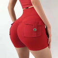 Red high-waisted workout shorts with a buttoned feel pocket for celebrity nude feel yoga wear inspiration
