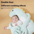 Mint green plush dinosaur baby pillow in light blue textured fabric with yellow spikes and white inner lining