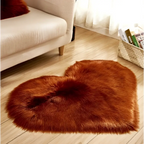 A plush heart shaped living room rug in rust color with soft faux fur texture for cozy decor