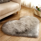 A plush heart shaped living room rug in soft gray faux fur texture designed as a mint green plush accent piece