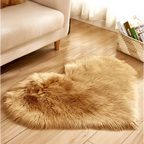 A plush heart shaped living room rug in golden brown faux fur complementing a mint green plush decor