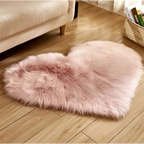 A plush pink faux fur heart shaped rug contrasting with the mint green plush heart shaped living room rug product title