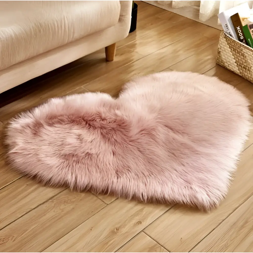 A plush pink faux fur heart shaped rug contrasting with the mint green plush heart shaped living room rug product title