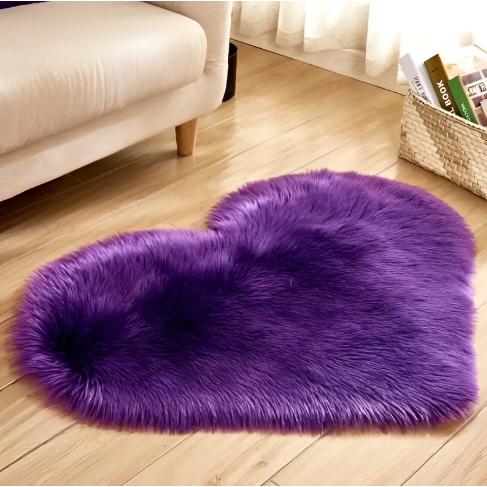 A plush heart shaped living room rug in vibrant purple with soft faux fur texture, contrasted to mint green plush options