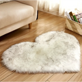 Fluffy white and gray faux fur plush heart shaped rug for living room with mint green plush accents