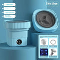 Mint green ribbed folding washing machine with compact sky blue ribbed plastic exterior and transparent lid for efficient washing