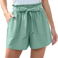 Mint green high-waisted shorts with ruffle bow waist tie and front pockets for stylish summer wear