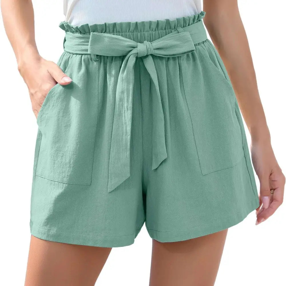 Mint green high-waisted shorts with ruffle bow waist tie and front pockets for stylish summer wear