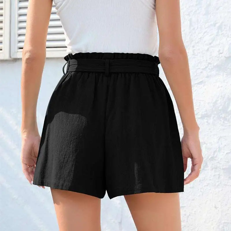 Mint green high-waisted shorts with ruffle bow waist tie and front pockets for stylish casual wear