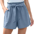 Mint green high-waisted shorts with ruffle bow waist and matching fabric belt tied into a front bow with pockets