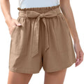 Beige high-waisted shorts with ruffle bow waist tie and two front pockets, styled like mint green shorts