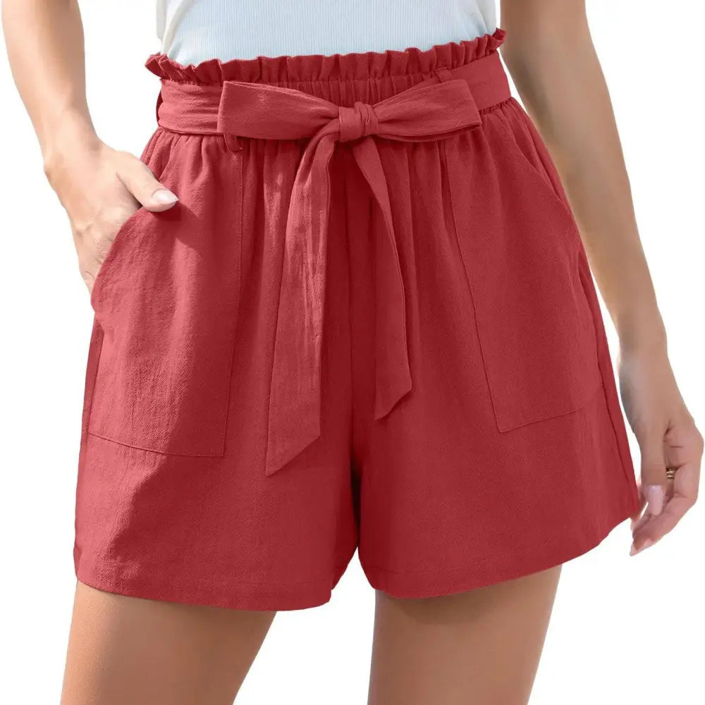 Red high-waisted shorts with gathered waistband and ruffle bow waist tie fabric detail in a mint green style