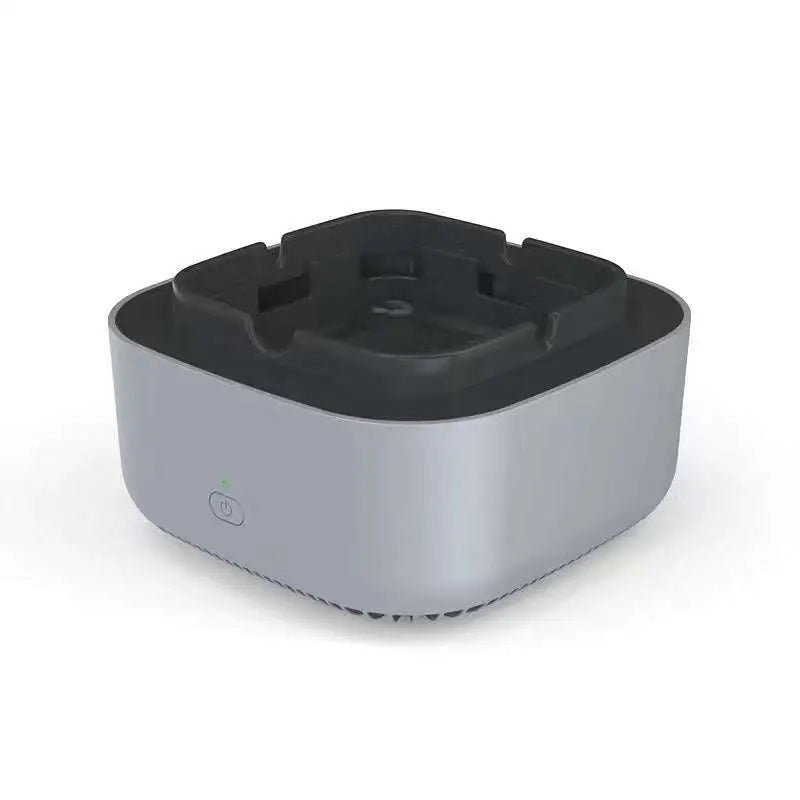 Silver metallic air purification ashtray with black interior and green light power button for green smoke removal air