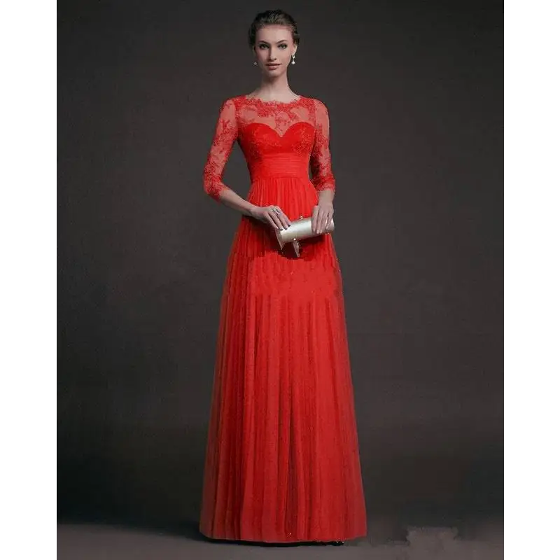 A vibrant red long sleeve lace gown with three quarter sleeves and a flowing pleated skirt in lace gown style