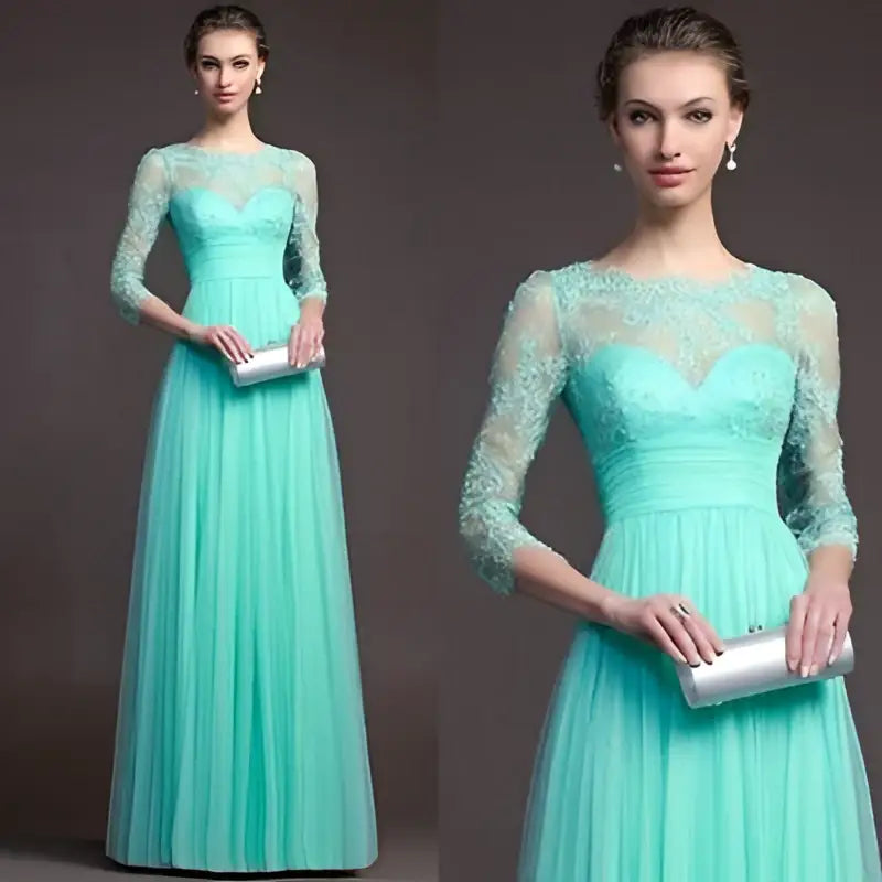 A woman wears a mint green long sleeve lace gown with a flowing tulle skirt paired with a silver clutch