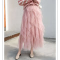 A delicate mint green tiered mesh skirt with layered pink tulle skirt and flowing ruffled design