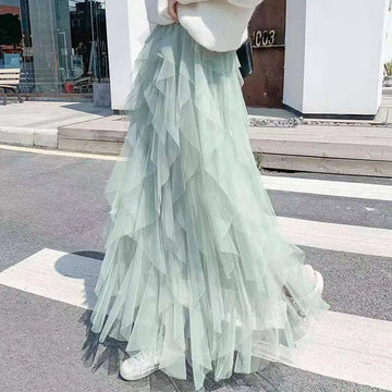 Mint green tiered tulle skirt with flowing ruffled layers and delicate mesh stitching for easy matching