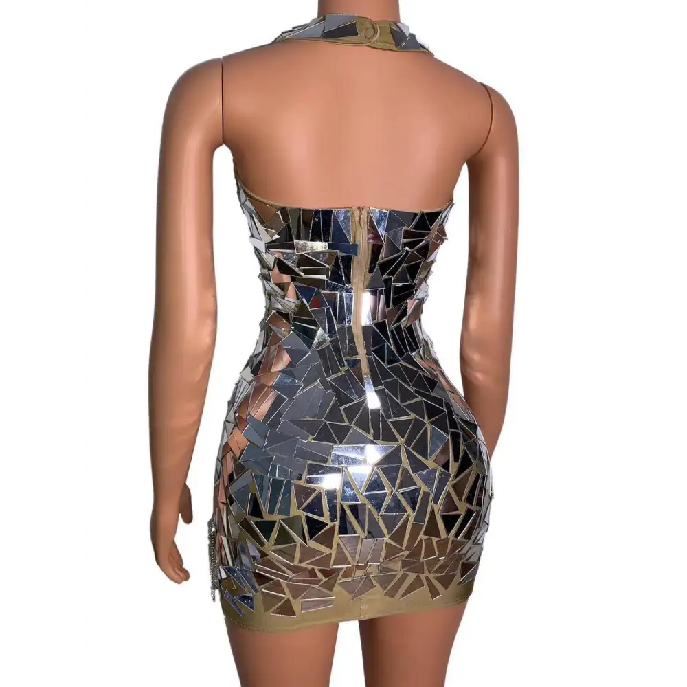 A shimmering form-fitting mini dress with silver and gold mirror shards for nightclub dj female stage performances