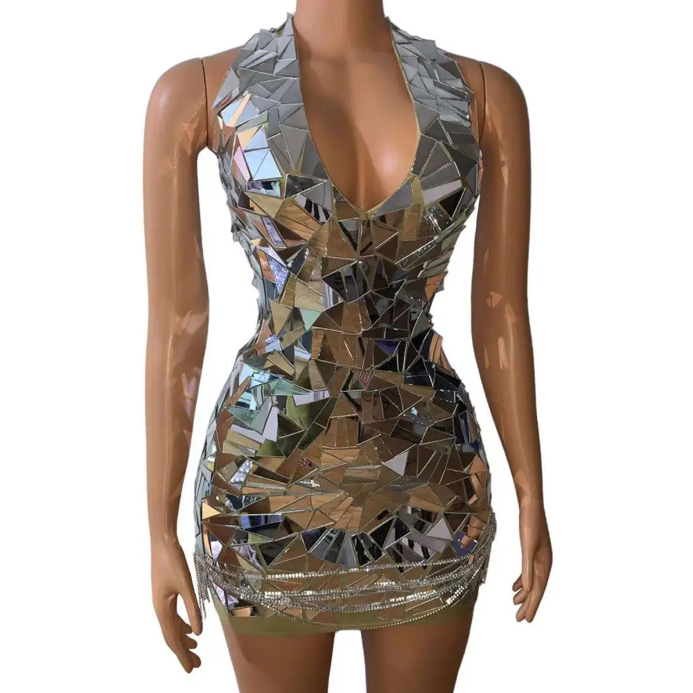 A form-fitting mini dress for nightclub dj female with reflective mirror pieces and rhinestone trim for stage nightclub performances