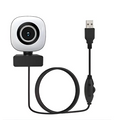 White square model 4k live black computer camera with circular lens and silver ring connected by coiled usb cable