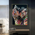 Modern abstract zebra canvas painting featuring two zebras with swirling rainbow stripes on black background