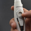 White aquaprod electric nasal spray with silver accent and on off button featured alongside modern electric tooth punch with clear tank