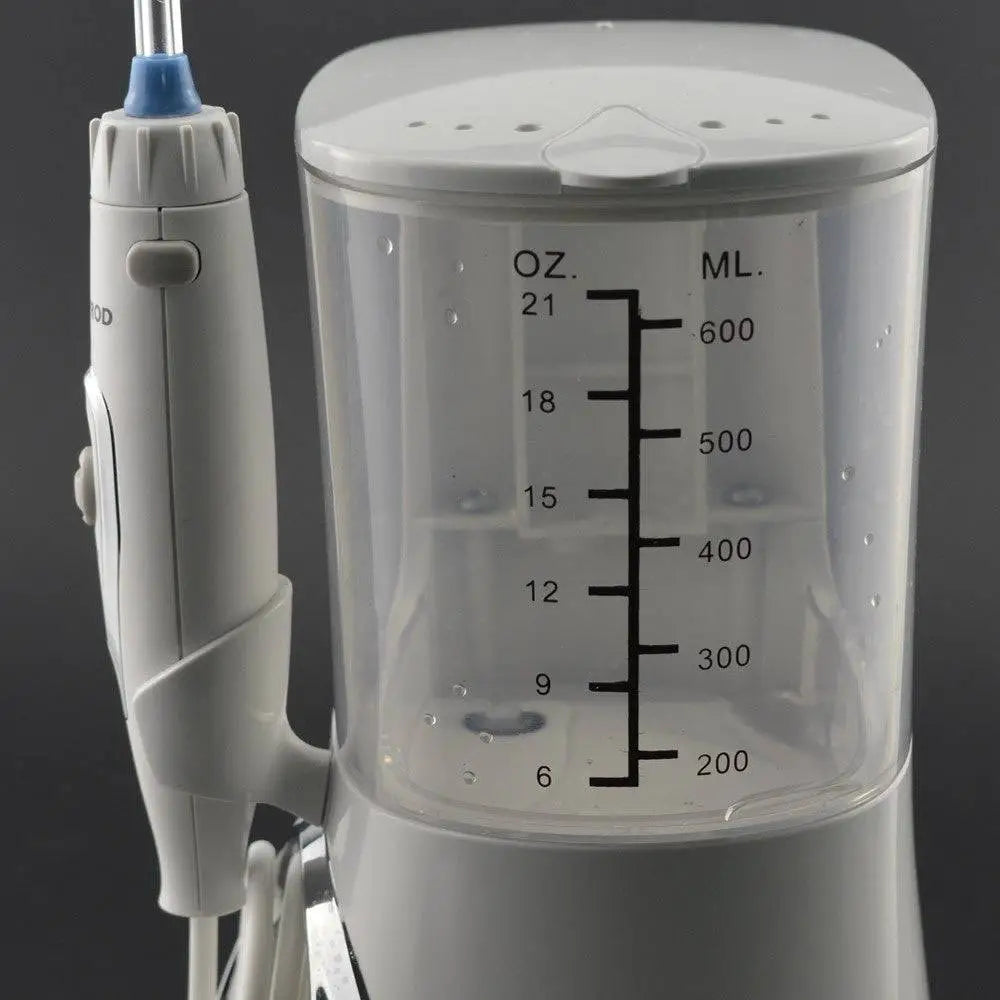 Modern electric tooth punch in white with a clear tank marked in ounces and milliliters and a blue-tipped punch water flosser nozzle