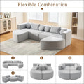 Modern grey modular sectional sofa bed with curved-end modules in soft fabric upholstery for flexible use