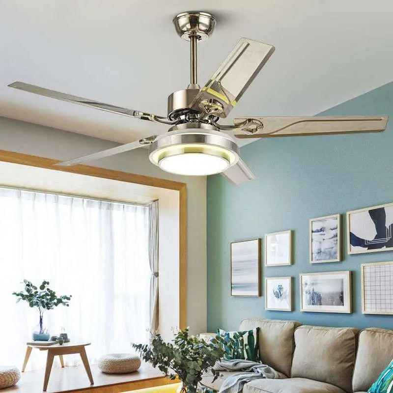 Modern home dining ceiling fan light with five sleek metallic blades and a circular fixture for dining room ceiling use