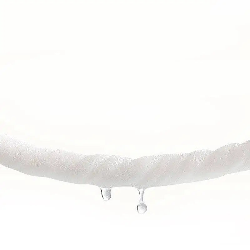 White twisted rope with clear water droplets hanging from its end near modern household baby wet wipes heater with digital display
