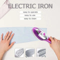 Modern purple and silver handheld steam ironing machine with steam function for efficient garment care