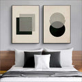 Two framed modern vintage black poster abstract prints with minimalist geometric designs in black white and beige tones