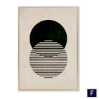 Modern vintage black framed wall art featuring a minimalist abstract black poster with bold circle and gold-toned frame