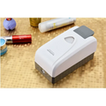 Modern wall mounted foam soap dispenser in white and gray plastic with sleek modern design for efficient use