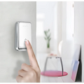 Modern white and silver wireless door bell with a silver frame and minimalist design featuring the tuya brand name