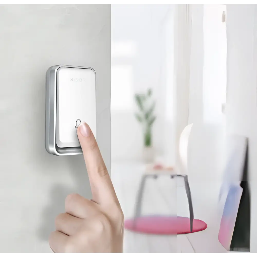 Modern white and silver wireless door bell with a silver frame and minimalist design featuring the tuya brand name