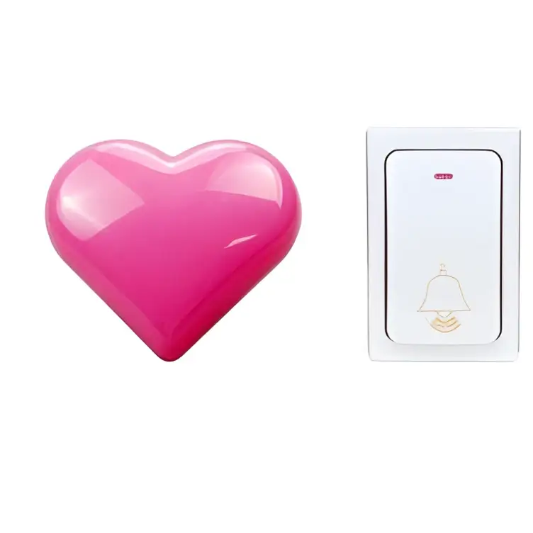 A glossy pink heart-shaped button on a modern white and silver wireless door bell for home use
