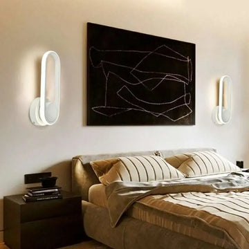 Modern white oval bedroom wall lamp with sleek minimalist design for oval bedside bedroom use