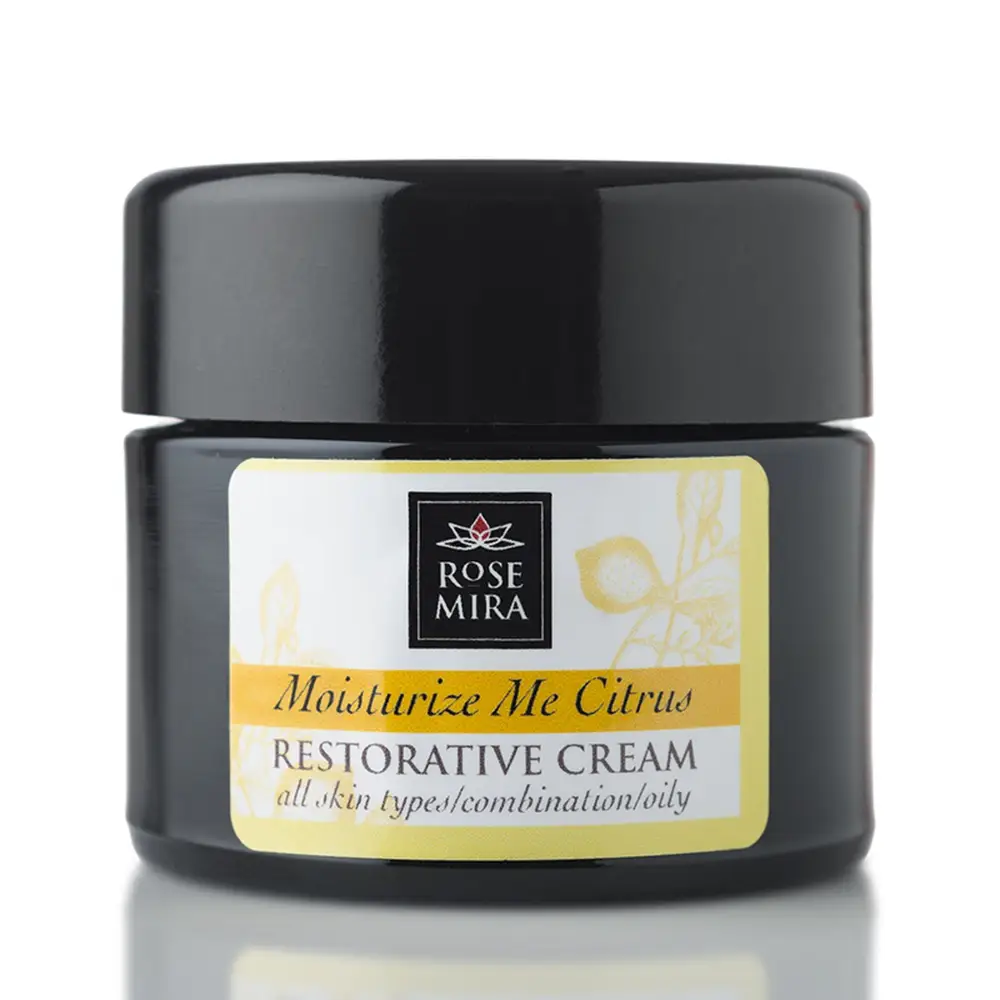 Black glass jar with glossy black lid and yellow white label for rose mira’s citrus restorative cream moisturizer