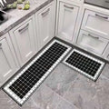 Black and white mosaic tile kitchen floor mat with decorative border featuring environmentally friendly materials
