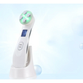 White handheld mr201wq led photon skin rejuvenation beauty device with glowing green head and five silver treatment pads