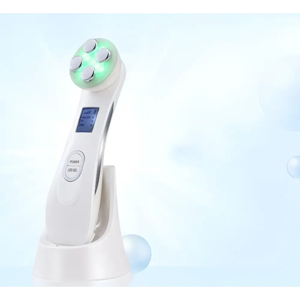White handheld mr201wq led photon skin rejuvenation beauty device with glowing green head and five silver treatment pads