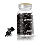 Sevich hair care capsules in a clear glass bottle with shiny black gel ampoules and a gold rim for multicolor hair care benefits