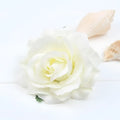 A delicate ivory silk rose with layered petals and yellow center in a multicolor red roses flocking cloth headdress hairpin