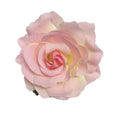 A delicate pink rose with soft petals and a yellow center on a multicolor red roses flocking cloth headdress hairpin