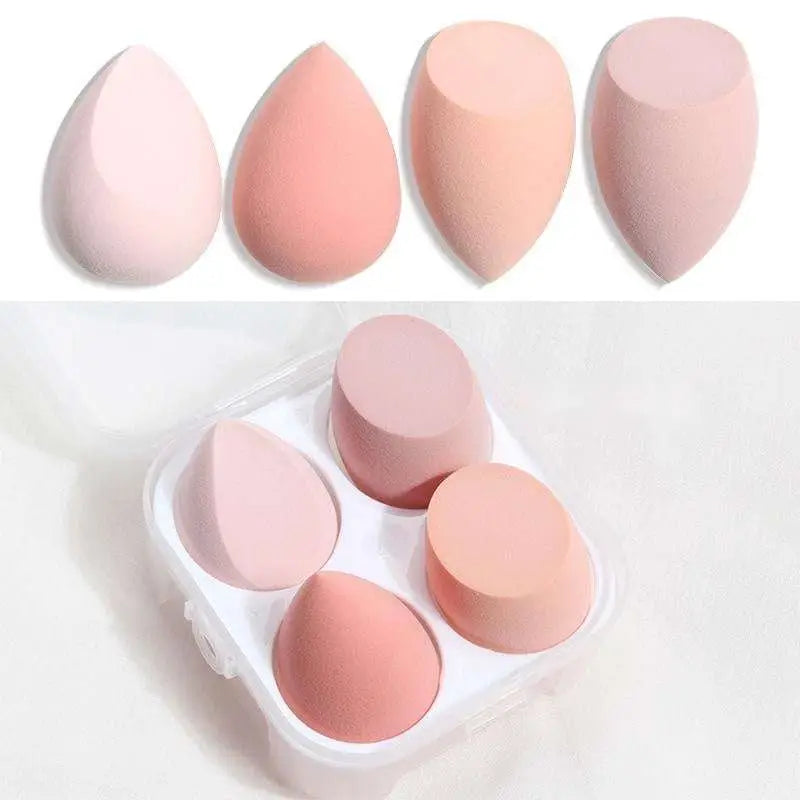 Set of five pastel pink and peach hydrophilic polyurethane beauty egg makeup sponges in clear plastic case