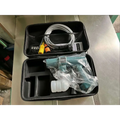 Multifunctional car wash pressure water gun in teal and white, packaged in a foam-lined carrying case with hose and connectors